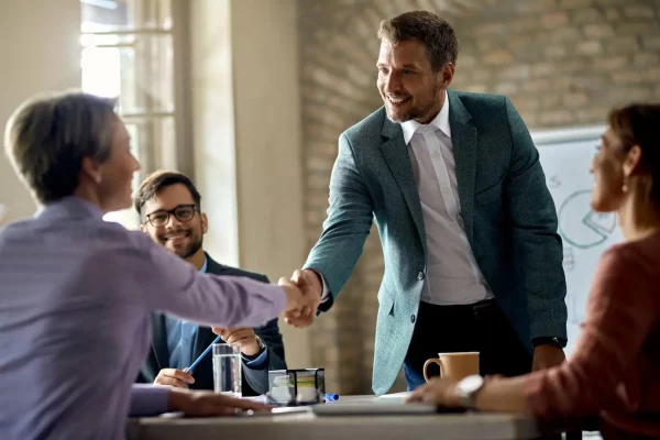 business-coworkers-shaking-hands-during-meeting-office-focus-is-businessman_637285-7009.webp